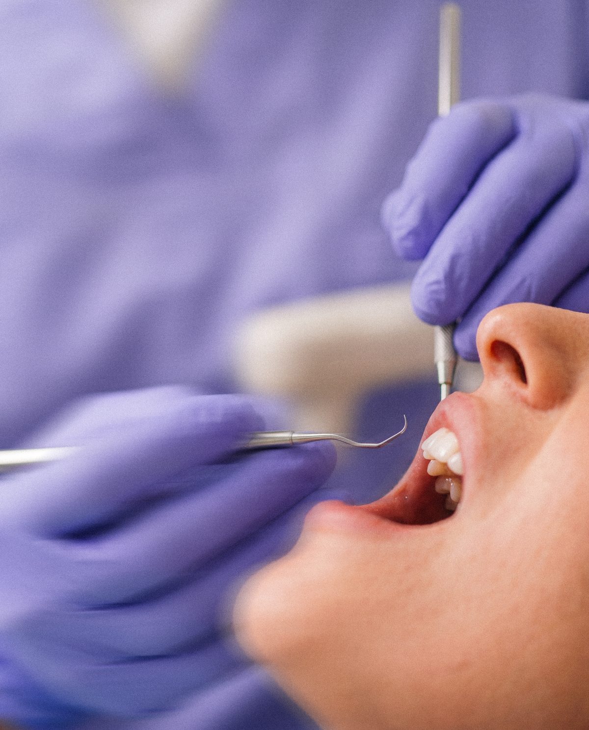 A calm dental examination in periwinkle gloves